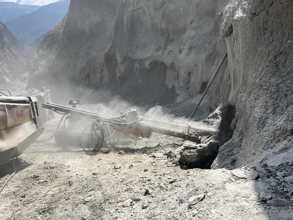 Drilling for 25m long cable tendons (120 MT) in power intake area at berm EL 1387 m.